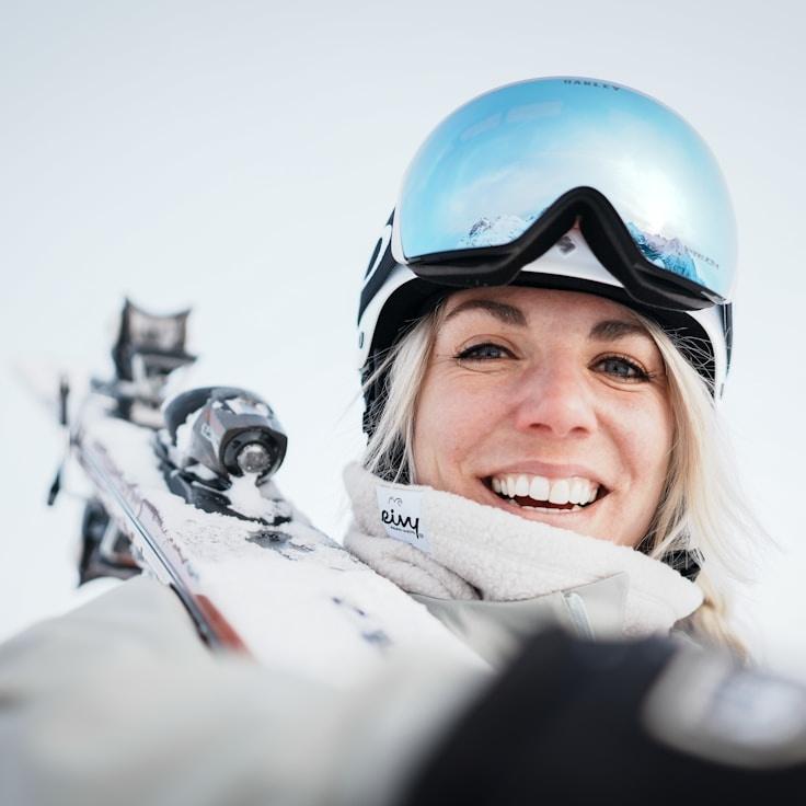 Kaveri Mehta, Lead Design Curator at TimberFieldCliff, reviewing corporate floral arrangements